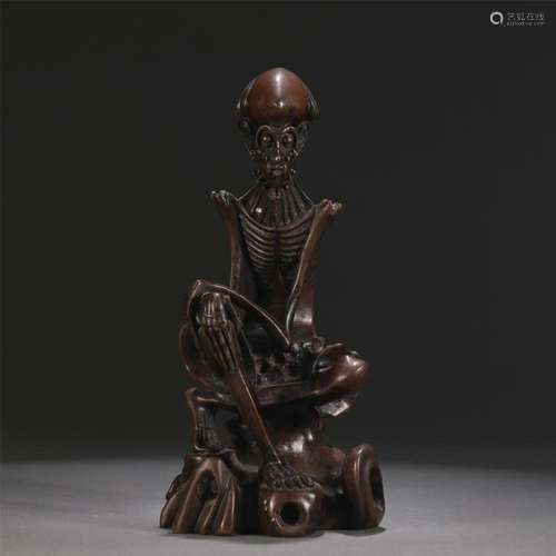 A CHINESE BRONZE FIGURE STATUE