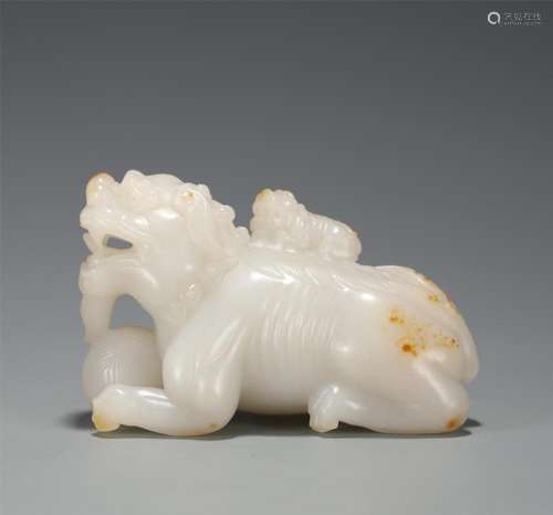 A CHINESE WHITE JADE MOTHER AND SON BEAST ORNAMENTS