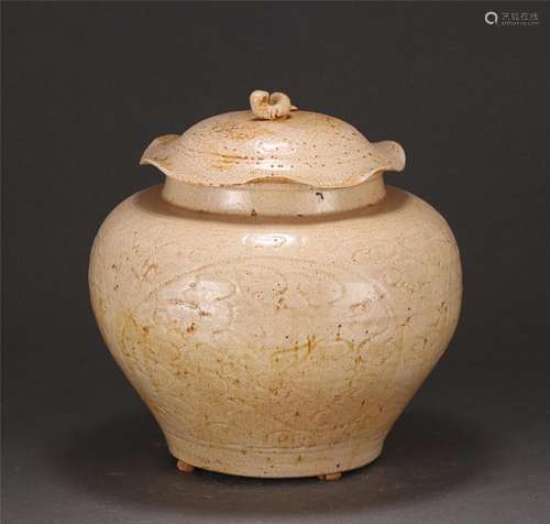 A CHINESE CARVED LOTUS PORCELAIN LIDDED JAR