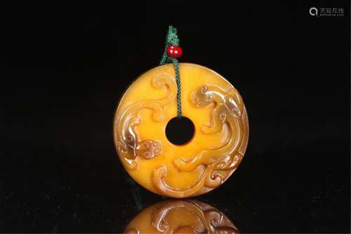 A CHINESE JADE ROUND PENDANT