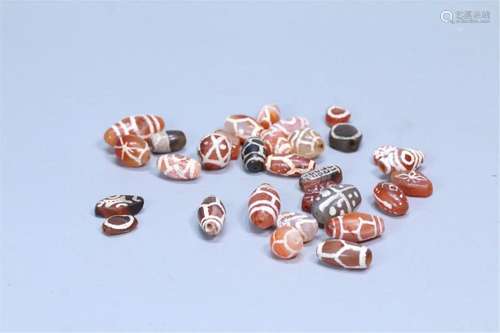 A GROUP OF CHINESE AGATE DZI BEADS