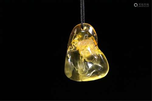 A CHINESE AMBER PENDANT