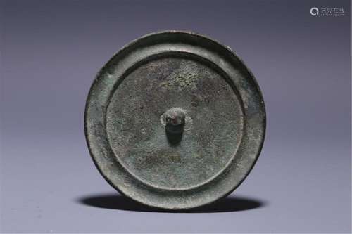 A CHINESE BRONZE MIRROR