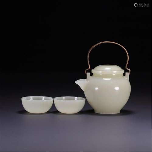 A CHINESE JADE TEAPOT AND TWO TEACUPS