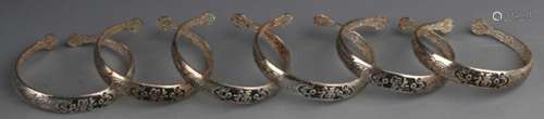 GROUP OF FINELY CARVED SILVER PLATED BANGLES