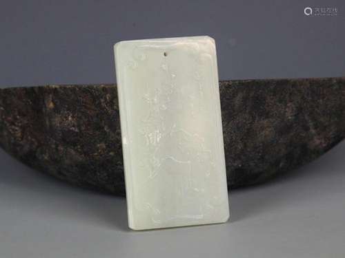 A FINELY CARVED GREENISH WHITE JADE