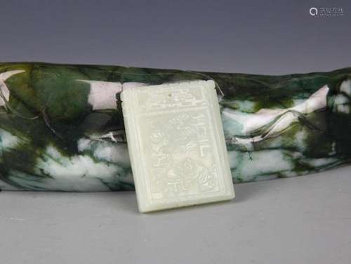 A FINELY CARVED HETIAN GREENISH WHITE JADE PENDANT