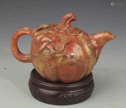 A FINELY CARVED SOAPSTONE TEAPOT