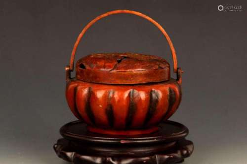 A FINE LOTUS SHAPED BRONZE CARRYING STOVE