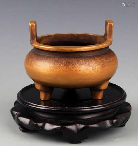 A DOUBLE EAR TRIPOD FOOT BRONZE CENSER