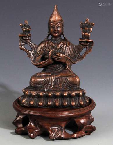 A SMALL BRONZE JE TSONGKHAPA STATUE