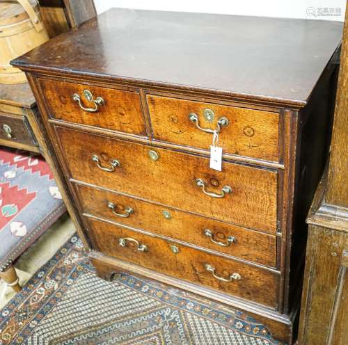 A George III oak chest of five drawers, on bracket feet, wid...