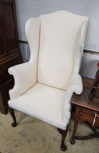 A George I red walnut wing armchair, with slender cabriole l...