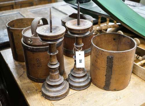 Six assorted treen measures and butter pails, a pair of pric...