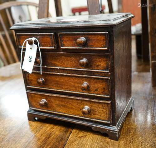An antique mahogany miniature chest of drawers, width 27cm, ...
