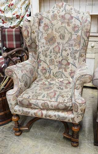 A William & Mary style walnut wing armchair, with flower...