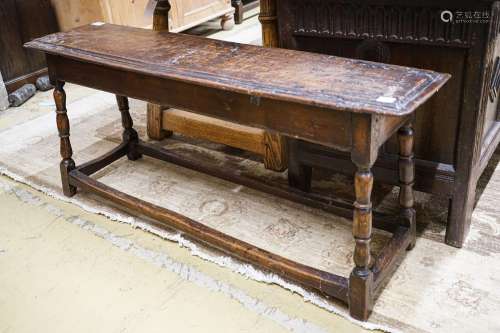A 17th century style oak long stool, with solid seat on turn...
