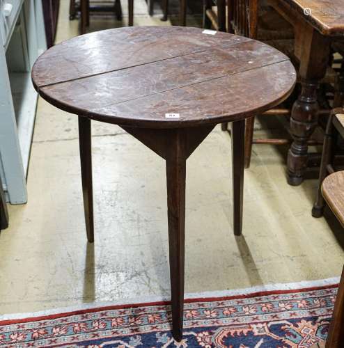 A George III oak cricket table, with circular top on tapered...