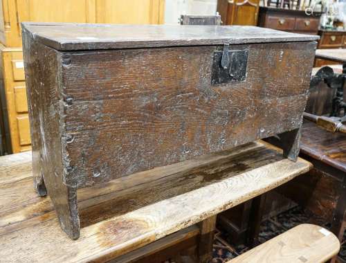 A 17th century oak and elm six plank coffer, width 104cm, de...