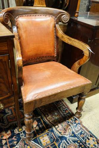 A pair of Victorian style hardwood elbow chairs with faded r...