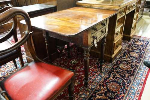 An early Victorian mahogany Pembroke work table, with twin f...