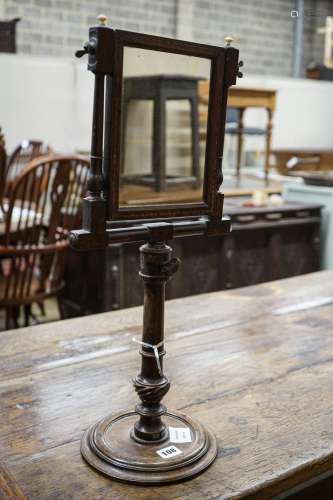 An antique stained beech and walnut telescopic shaving mirro...