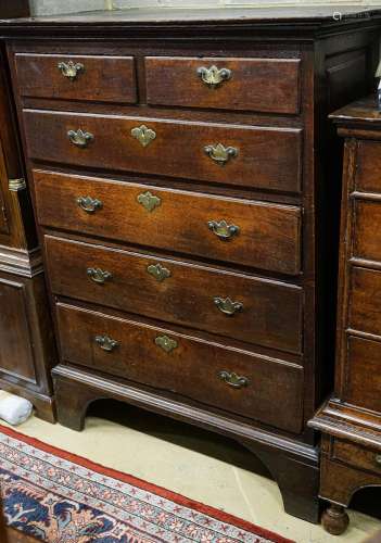 A George III oak chest of two short and four long drawers, o...