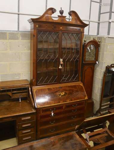 A George III style inlaid mahogany bureau bookcase, length 1...