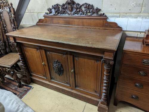A Victorian oak side cabinet, length 150cm, depth 62cm, heig...