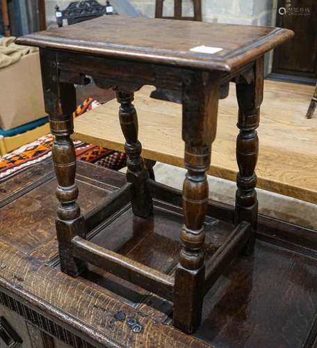 A 17th century style oak joint stool, with turned legs and c...