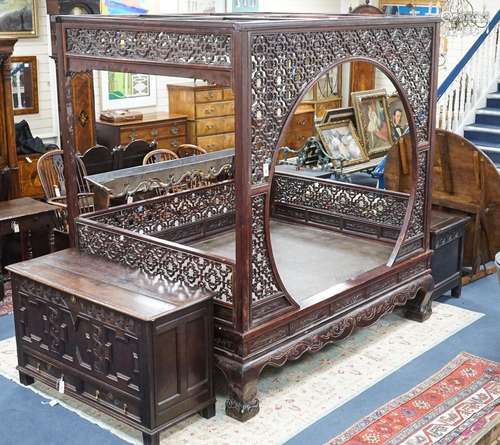 A Chinese carved elm opium bed, width 160cm, depth 207cm, he...