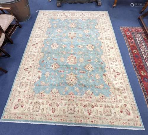 A modern Tabriz style pale green ground carpet, 304 x 240cm