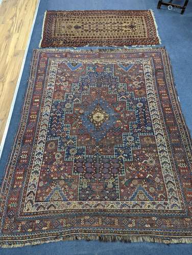 A Caucasian red ground rug and a Belouch rug, larger 200 x 1...