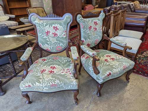 A pair of late Victorian mahogany upholstered drawing room c...