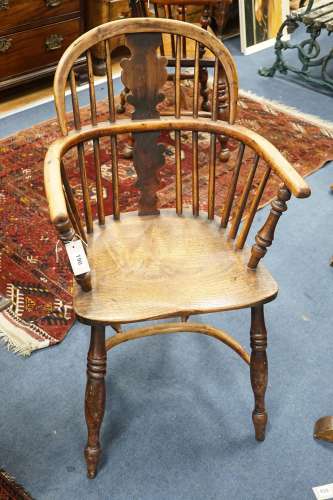 A 19th century yew and elm Windsor elbow chair with blind sp...