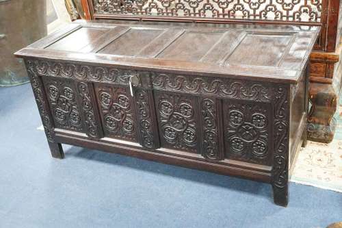 A 17th century Gloucestershire area carved, panelled oak cof...
