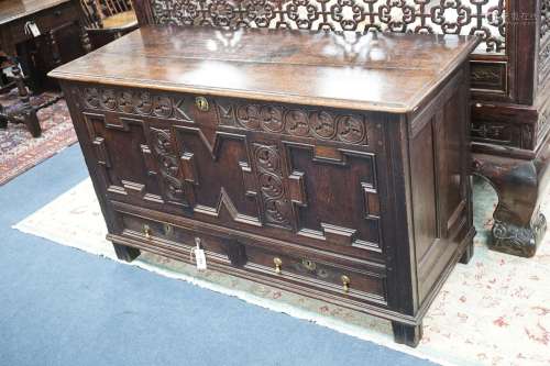 A William and Mary carved oak mule chest with K M initialled...