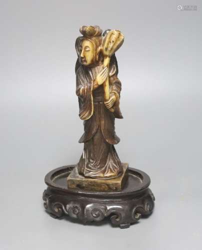 A 19th century Chinese soapstone figure of He Xiangu, associ...