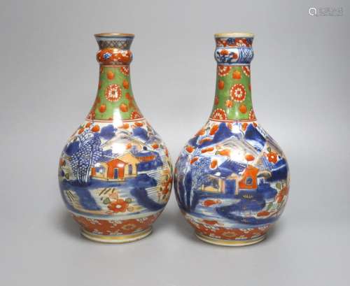 A pair of 18th century Chinese clobbered blue and white bott...