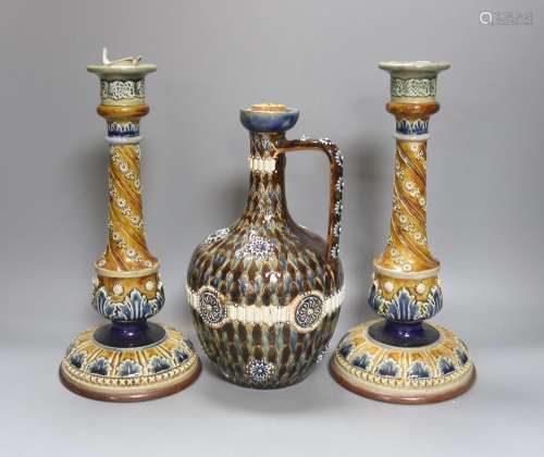 A pair of Doulton Lambeth stoneware candlesticks, height 30c...