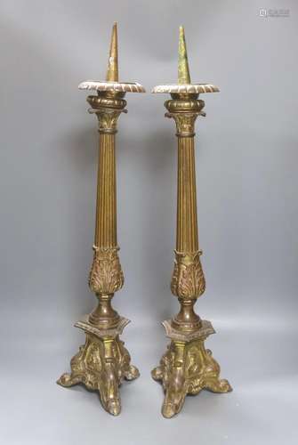 A pair of gilded brass pricket candlesticks 61cm