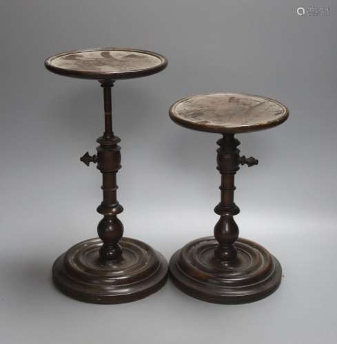A pair of Georgian style stained beech adjustable candle sta...