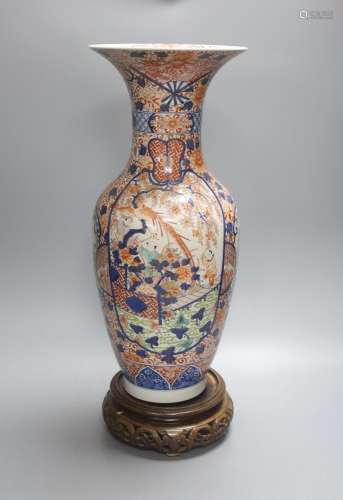 A large 20th century Japanese Arita porcelain vase, wood sta...