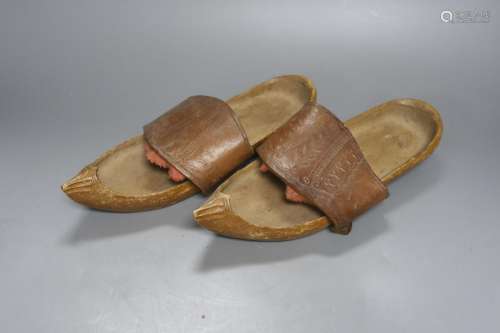 A pair of Eastern carved shoes 28cm