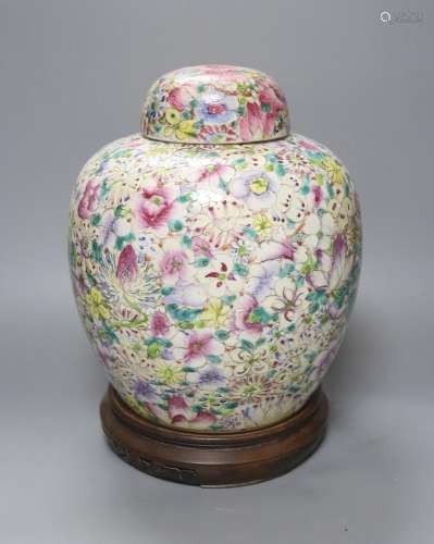 A Chinese thousand flower famille rose jar and cover, early ...