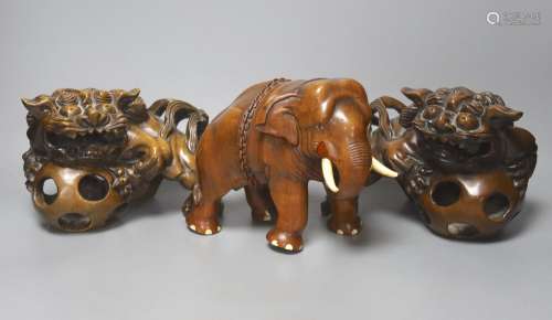 An Indian padouk wood figure of an elephant and a pair of wo...