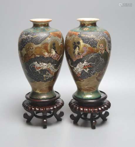 A pair of Japanese Satsuma pottery vases, depicting immortal...