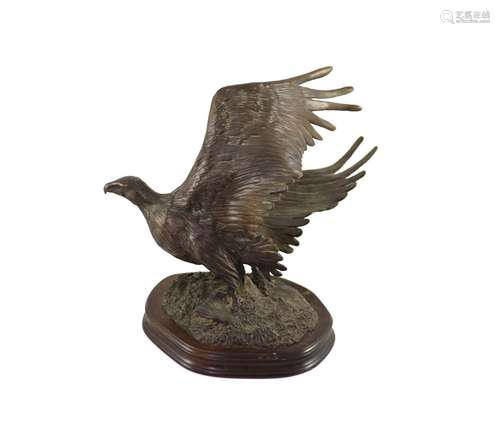 Tim Nicklin. A bronze model of an Osprey catching a salmonon...