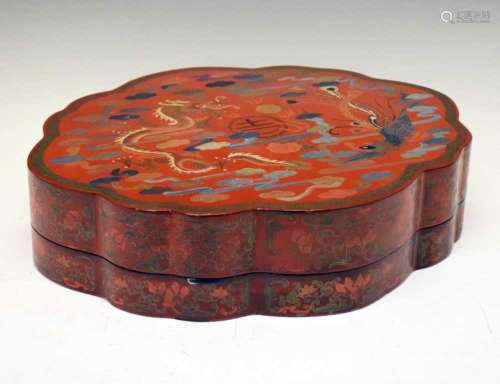 Chinese red lacquer box of oval shaped form with dragon deco...