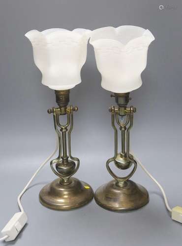 A pair of brass gimbaled ships lamps